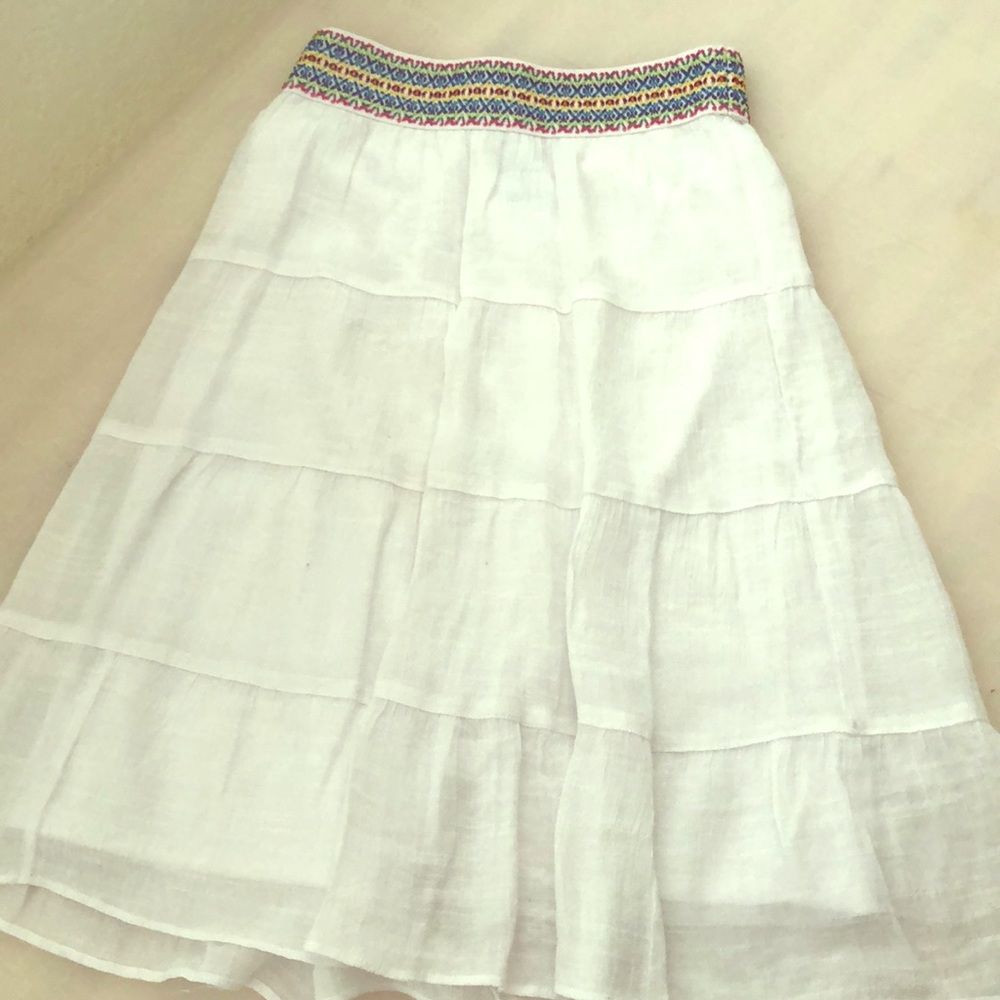 White skirt with pattern on top
